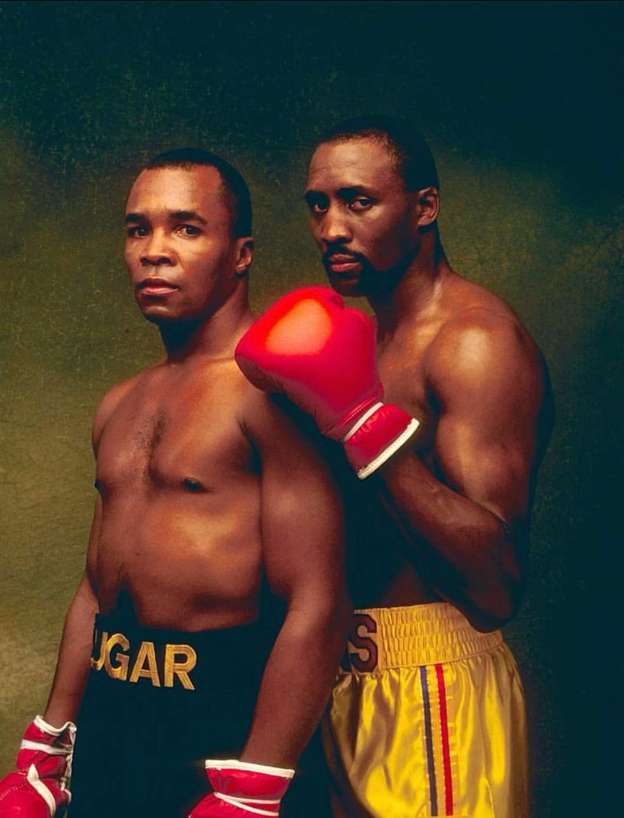 Two champions posing for a studio portrait, 1980s