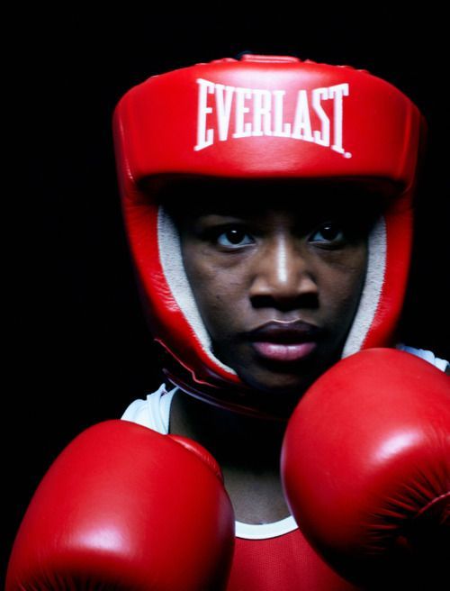Young boxer in sparring headgear, portrait